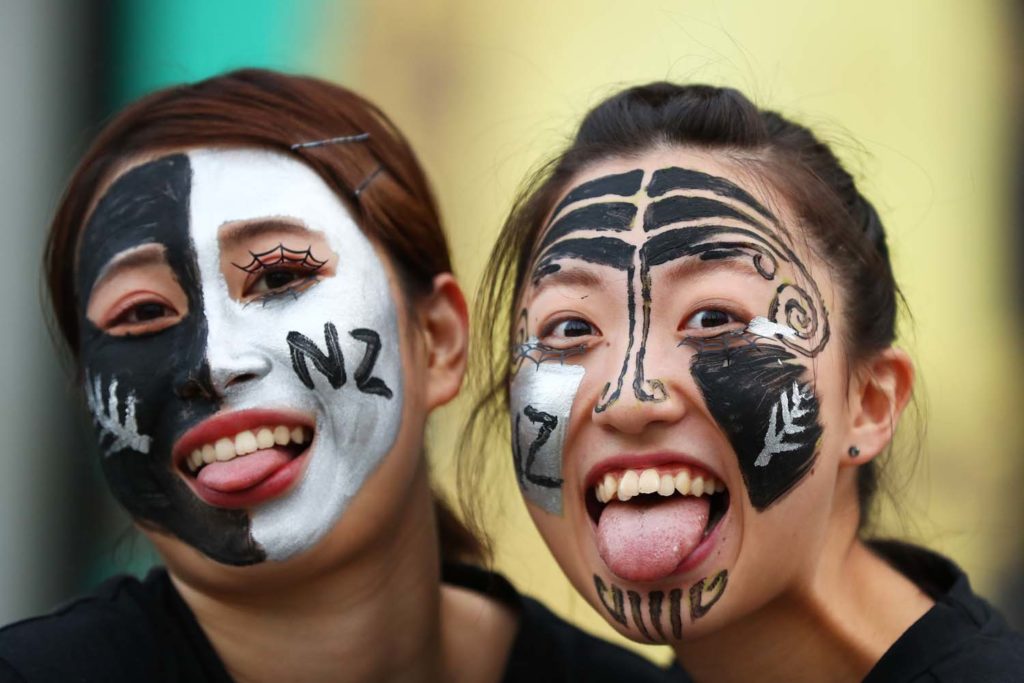 YOKOHAMA, JAPAN - SEPTEMBER 21: Fans pose for photographs during the Rugby World Cup 2019 Group B game between New Zealand and South Africa at International Stadium Yokohama on September 21, 2019 in Yokohama, Kanagawa, Japan. (Photo by Francois Nel - World Rugby/World Rugby via Getty Images)